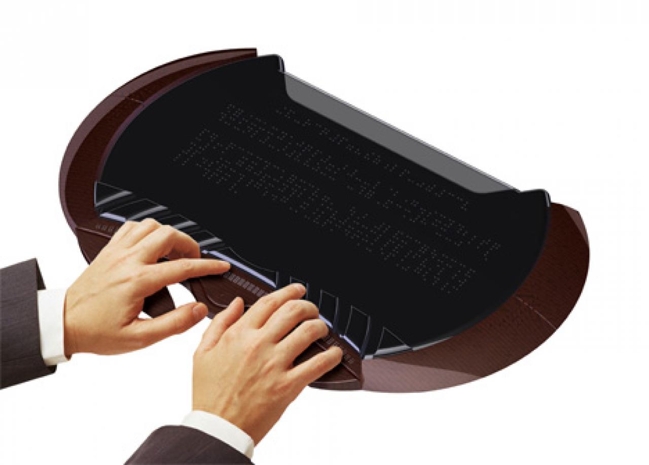 [02/03/2008] Weiterhin kann eine, aus neun Knöpfen bestehende, Braille-Tastatur geformt werden, wobei der Nutzer anschließend kontrollieren kann was er getippt hat. (Bild: Yanko Design)