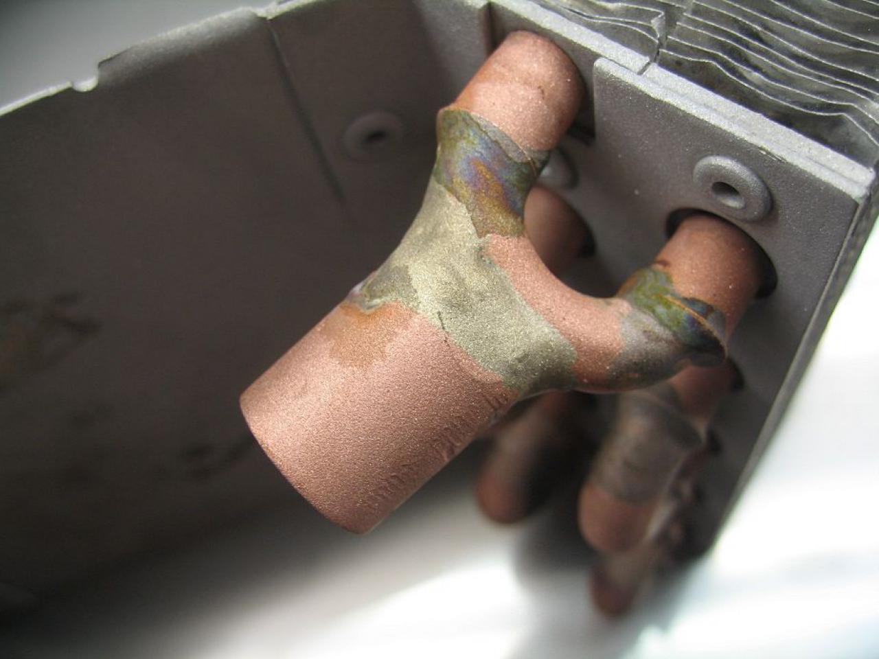 [23/12/2011] Externer runder Hingucker-Radiator: Holz trifft auf Lochblech (7)