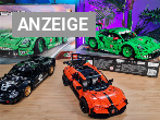 Die Lego-Autos Bugatti Chiron Pur Sport, 1966 Ford GT40 MKII und Porsche 911 GT3 R REXY AO auf einem Holztisch