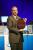 Justin Rattner, Intel Corporate Technology Officer, holds up a Penryn wafer during his keynote at the Intel Developer Forum in Beijing on Tuesday. Penryn is the codename of Intel's next-generation Intel® Core"2 processor family, which is based on our industry-leading 45-nanometer (nm) Hi-k metal gate process technology and latest microarchitecture enhancements.
