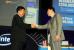 Intel Vice President Eric Kim congratulates Trigem CEO and President Henry Park, whose Korean-based company took top honors - and a $700,000 check - in the $1 million Intel Core Processor Challenge. The announcement was made during Kim's keynote at the Intel Developer Forum on Tuesday in Beijing.