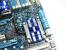 Gigabyte GA-P55A-UD6 - Marvell SATA-Revision-3.0-Controller-Chip (unter der Kühlkonstruktion in der Mitte des Bildes)
