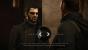 Kein Matrix-Rebell mit Bart, sondern unser sich in einem Dialog befindlicher Protagonist Adam Jensen in <a href="https://de.gamesplanet.com/game/deus-ex-mankind-divided-steam-key--3072-1?ref=computec"><strong>Deus Ex: Mankind Divided</strong></a><span class="affiliateIcon fontIcon" onclick="msgBox.showAffiliateMsg();"></span><strong>.</strong>