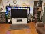 TauroBondani: "Unser Heimkino ist inzwischen deutlich bescheidener geworden. Wohnzimmerintegration, ohne den Charakter des Wohnzimmers zu sehr zu verändern.<br><br>Beamer ist ein BenQ W2700 mit Amazon 4k-Stick und einem Panasonic UHD-Player UB824EGK.<br>2 Leinwände Esmart 120" hintereinander, 16:9 und 21:9<br>Lautsprecher sind vorne 2 Behringer B2030A und ein Subwoofer mivoc hype 10 g2<br><br>Da wir in einem Wohnblock leben, muss der Geräuschpegel leider sehr gedämpft bleiben.<br><br>Fürs normale Fernsehen ist ein OLED65C1 vorhanden." (1)