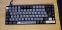 Rangod: "Sharkoon SGK50 S3 mit "Apollo" Keycaps im XDA-Profil aus Übersee.<br>Grund für den Keycap-Wechsel: Es gibt ein Kompatibilitätsproblem mit north-faced PCBs (Tastaturen, bei denen die RGB-LED über dem Schalter sitzt statt drunter) und Keycaps im Cherry-Profil. Aufgrund ihrer ergonomischen Form stoßen die Cherry-Tastenkappen der Reihe 3 mit dem nördlich ausgerichteten Switch zusammen, was dazu führt, dass betroffene Tasten nicht mehr richtig durchgedrückt werden können. Tippgefühl u. Akustik leiden. Einmal bemerkt, kriegt man es nicht mehr ignoriert. Abhilfe schaffen da andere, spezielle Switches...oder eine andere Tastatur..." (1)