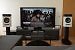 kadajawi: Zustand nachherVerbaute Technik<br>TV: Samsung S95C 65"<br>Zuspieler: Apple TV 4K (3rd Gen), Wiim mini (Tidal) und PC. Der Apple TV hängt an einem HDFury Arcana, daher dekodiert der Apple TV das Dolby Vision-Signal und ich kann auf dem Samsung DV sehen. Ein größerer Fernseher passt wegen dem Sitzabstand (1,5-2 Meter) nicht, ansonsten wäre es ein 77" S90C geworden... Ein LG-Panel wollte ich um alles vermeiden und der Sony mit Samsung-Panel ist irrsinnig teuer für ein minimal besseres Bild.<br>Lautsprecher: Focal Diablo Utopia Colour Evo vorne, Focal Kanta N°1 hinten (sobald die verkauft sind kommen wieder Nubert nuWave 85 hin, passt optisch zwar gar nicht...). Jeweils auf den Originalständern.<br>Subwoofer: Bowers &amp; Wilkins DB4<br>Verstärker: Benchmark AHB2 vorne, Audiolab 6000A hinten<br>AVP/DSP/Vorstufe: miniDSP Flex HT. Der Apple TV 4K decodiert das Surroundsignal zu Multichannel PCM, da kein anderes Format unterstützt wird. Der Wiim geht optisch in den miniDSP. Der miniDSP begradigt den Frequenzgang aller Lautsprecher bis 1 kHZ und gleicht abstandbedingte zeitliche Delays am Hörplatz aus. Außerdem werden tiefere Frequenzen aller Kanäle auf den Subwoofer umgeleitet und die fehlenden Kanäle werden auf die vorhandenen Lautsprecher verteilt. Ein AVR oder AVP war mir da nicht flexibel genug (parametrischer EQ...) und hat mir zu schlechte Wandler. Auf einen Center habe ich bewusst verzichtet - der Phantomcenter funktioniert super am mittleren Sitzplatz und wenn man sich entscheiden muss zwischen passendem Center oder Auto...<br>&nbsp; (4)